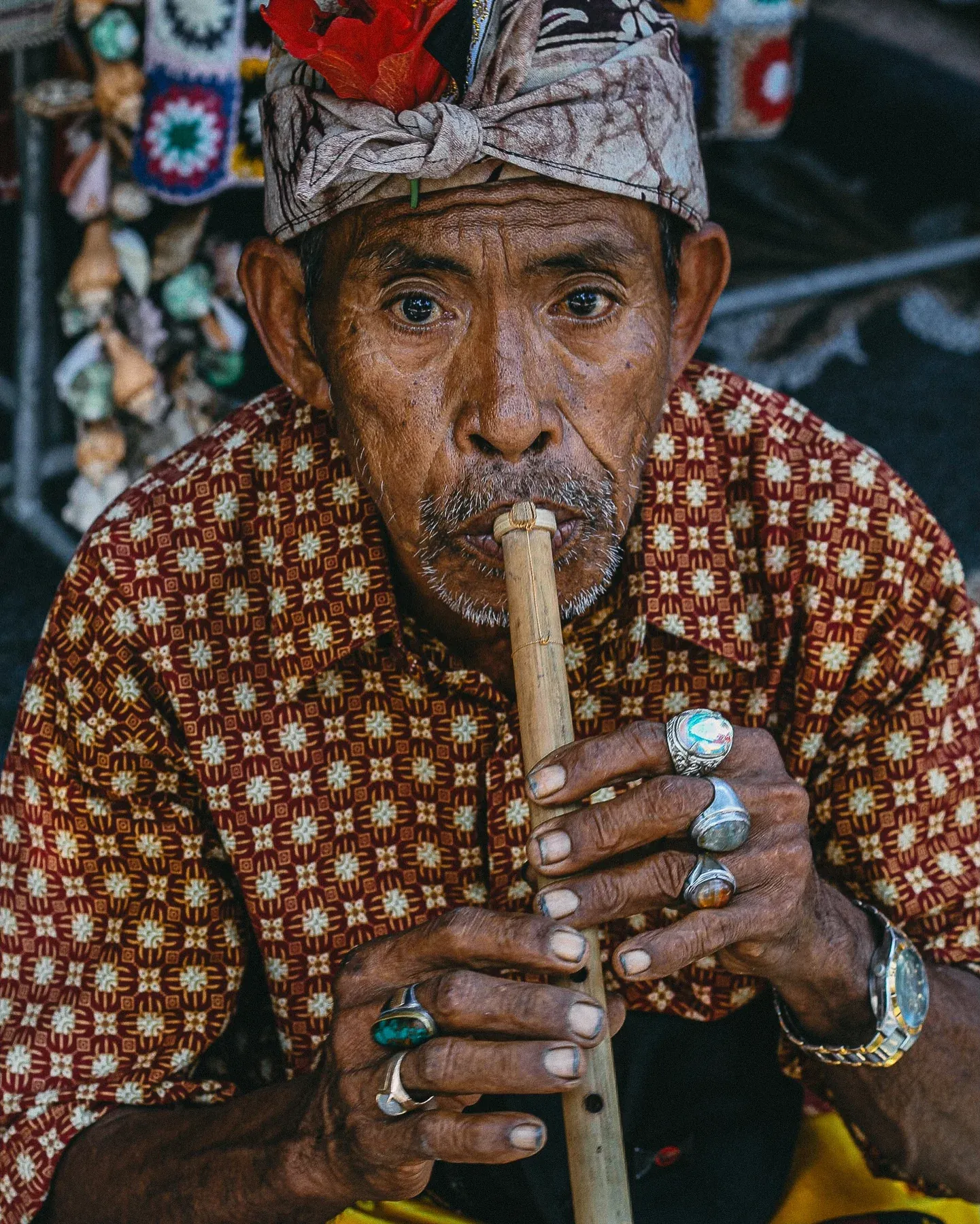 Man playing a wooden flute