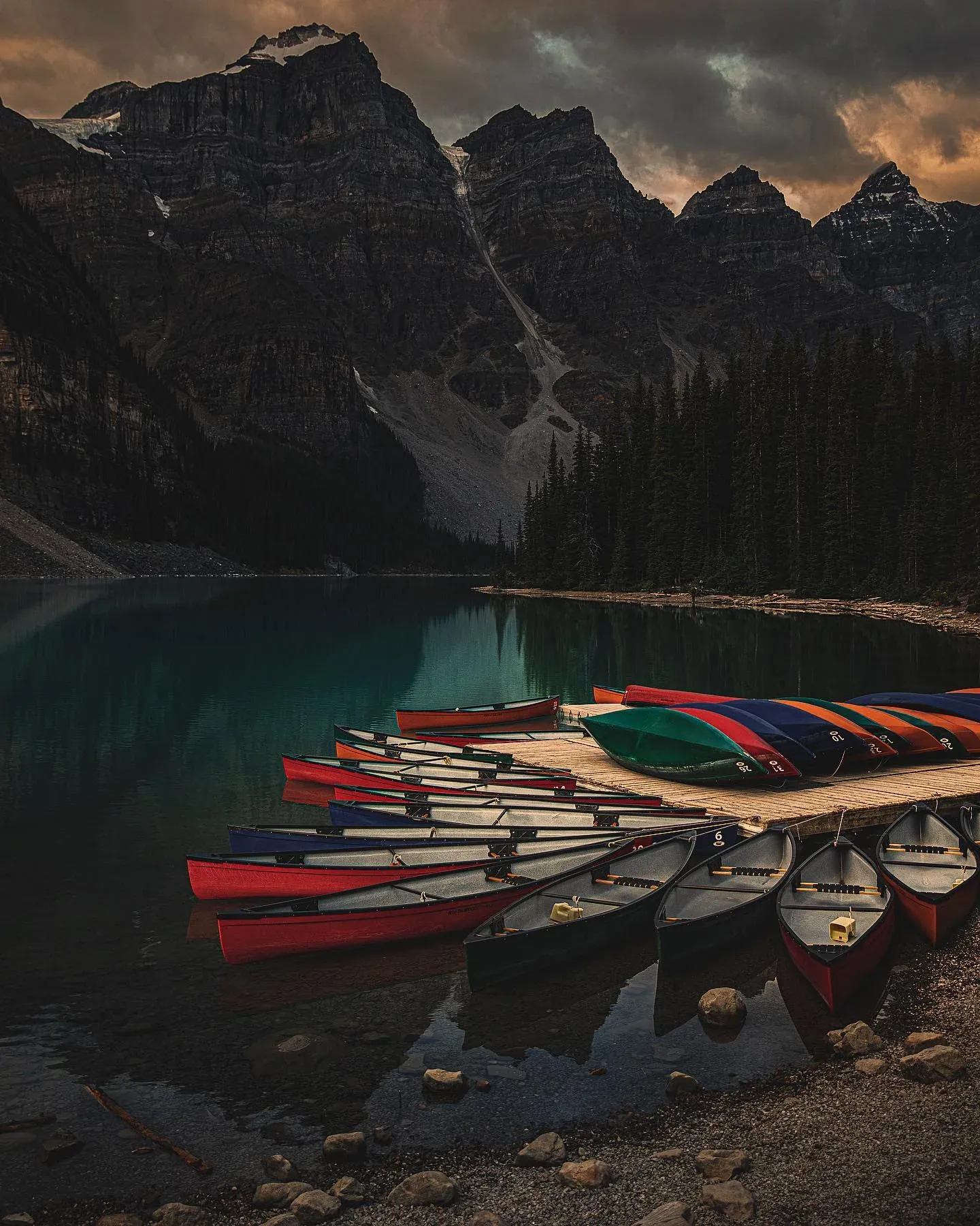 Canoes docked on a mountain lake