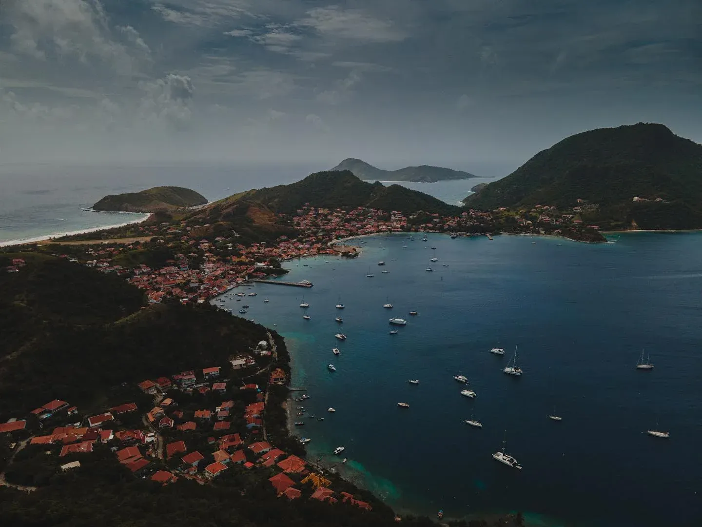 Aerial view of a bay dotted with boats